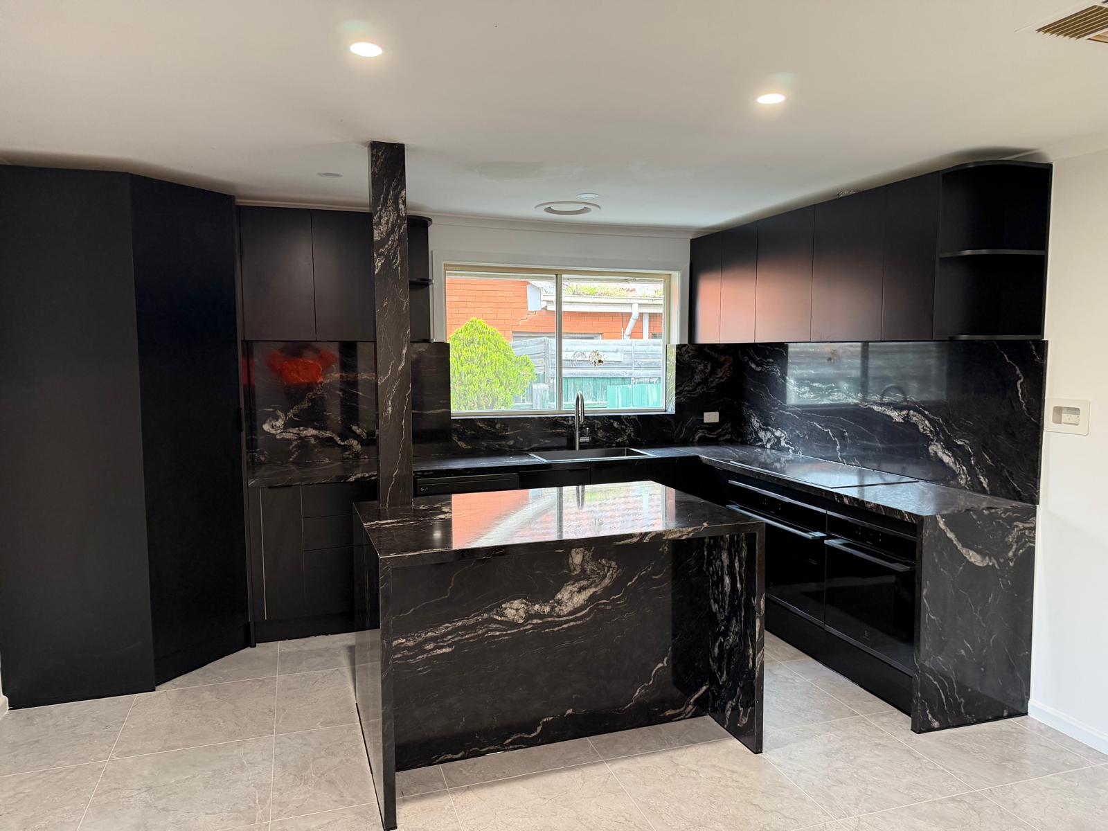 Black Granite Kitchen, Hampton - waterfall island in black granite